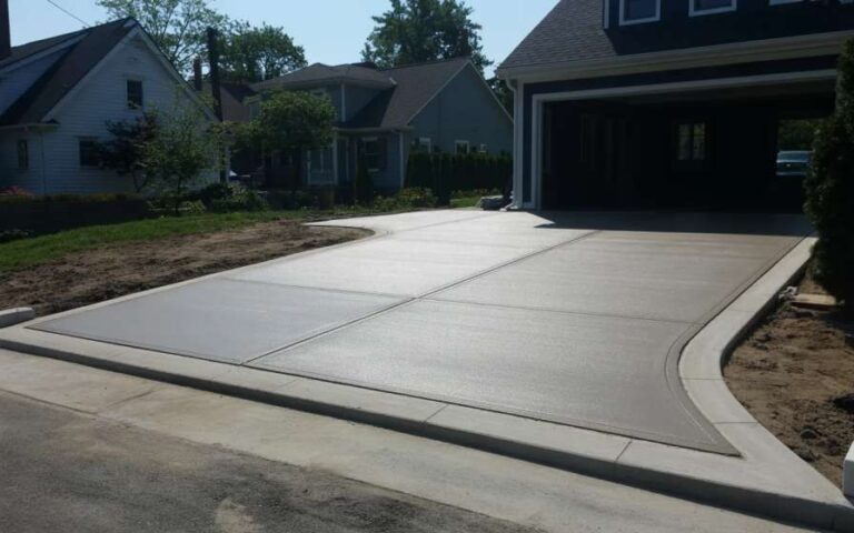 Professional driveway installation showing proper grading, clean concrete finish, and durable construction for New Jersey homes.